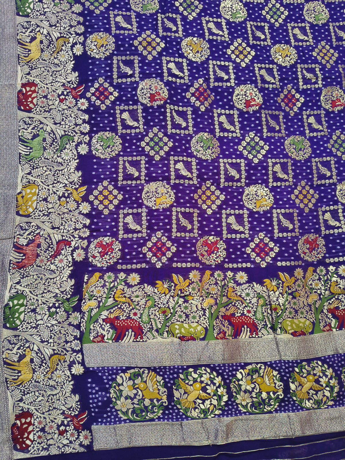 Regal Purple Khaddi Georgette Saree with Multicolor Floral & Zari Border